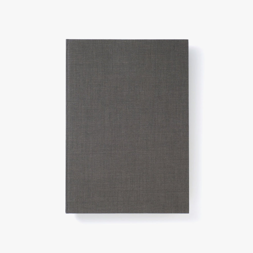 Sophisticated Kakimori A5 Notepad in grey with a Banshu-ori cotton cover and grid-patterned OK Fools Pure White pages.