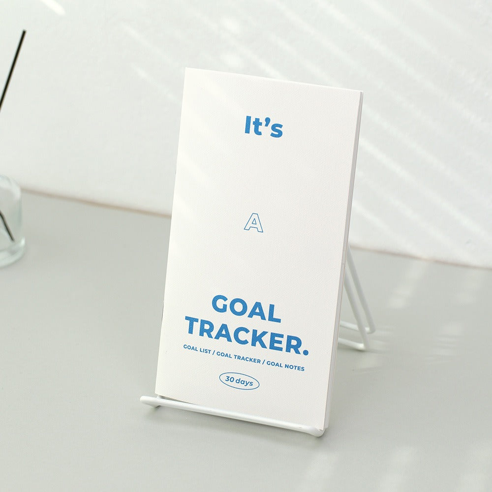 Paperian Goal Tracker Book in green, yellow, and blue text colours, a systematic tool for setting and tracking personal goals over 48 pages.