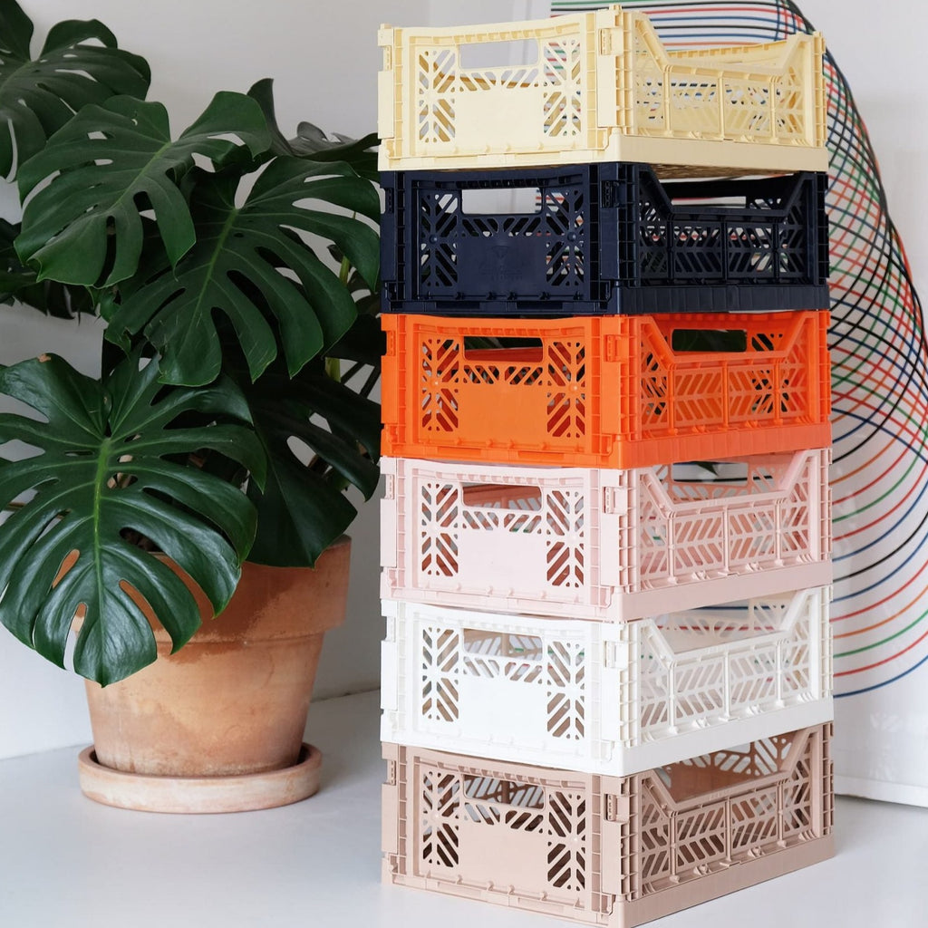 Aykasa Folding Crate - Midi in various colours, highlighting its foldable and stackable features.