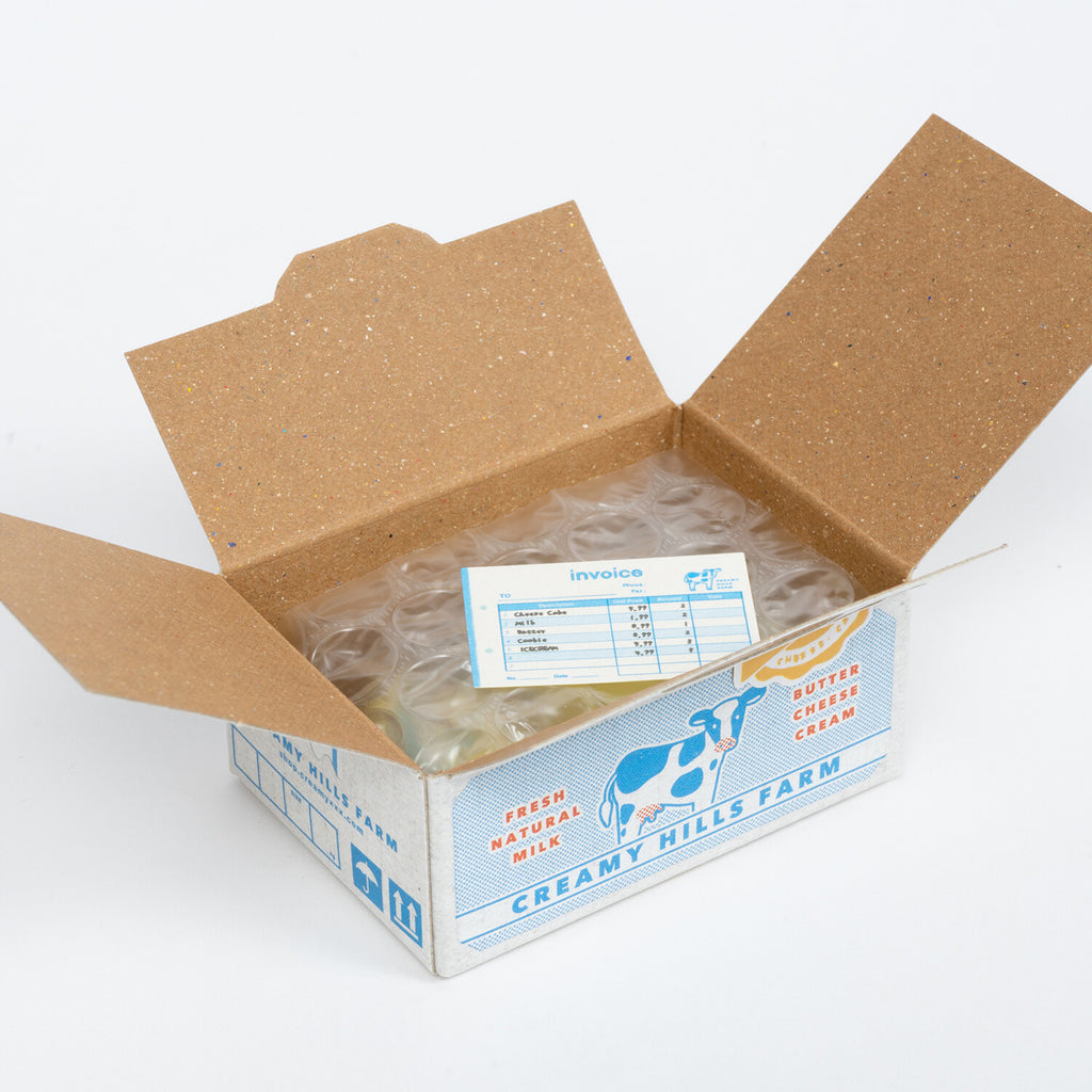 Creamy Hills Farm sticker box open with protective packaging, ensuring safe delivery and quality.