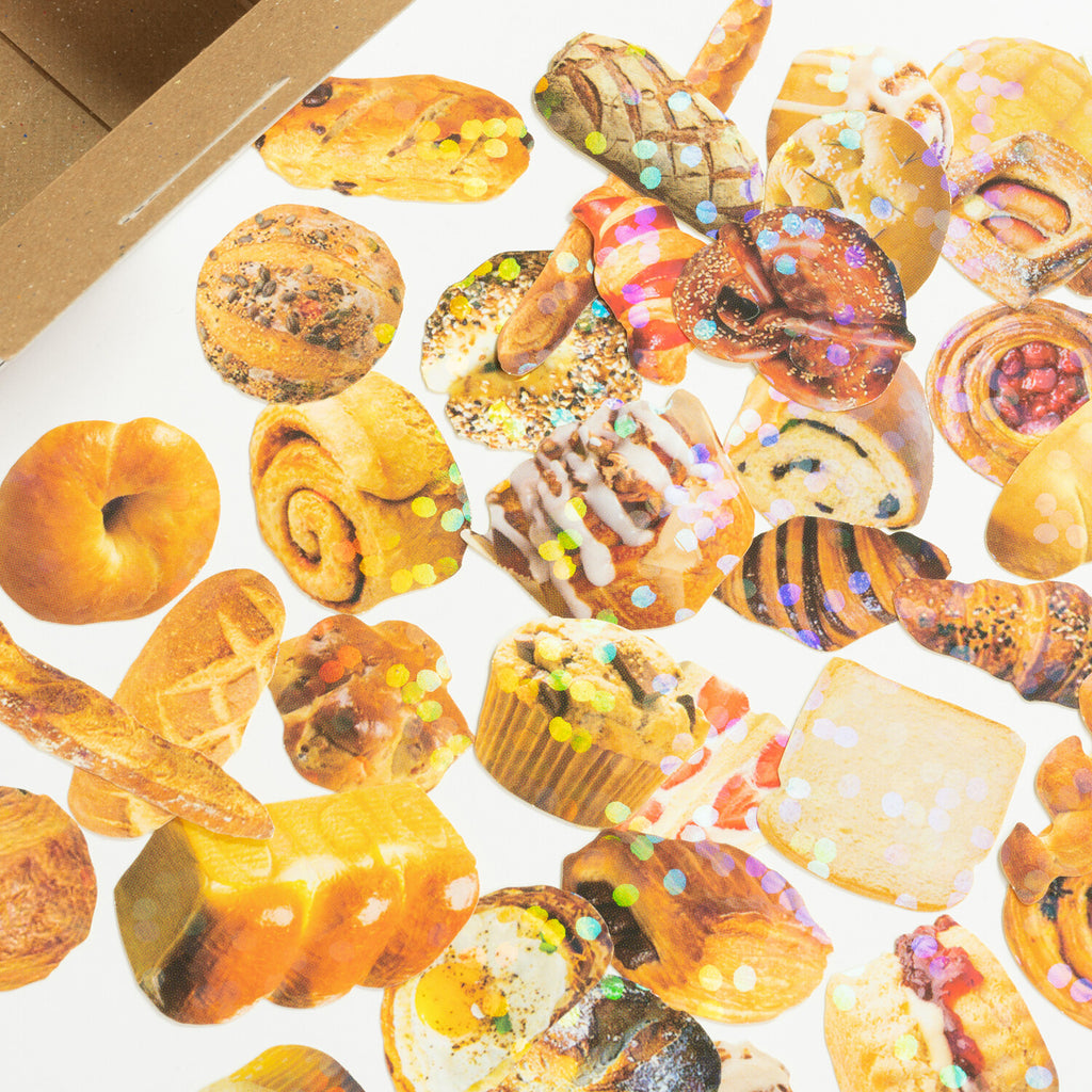 A colourful assortment of bakery-themed stickers scattered, showcasing various bread and pastry designs.