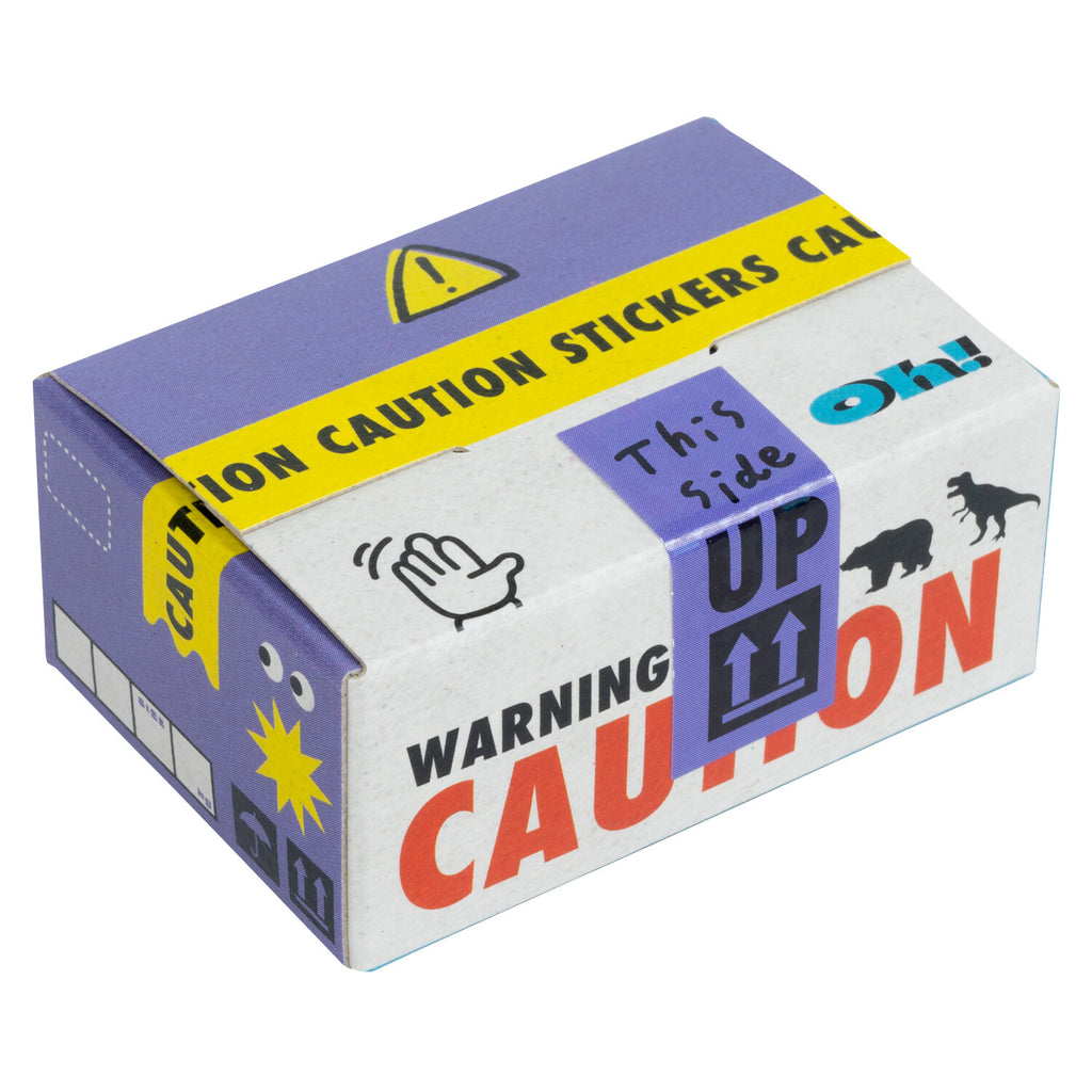 A compact, creatively designed sticker box with bold 'CAUTION' tape graphics and playful warning icons.