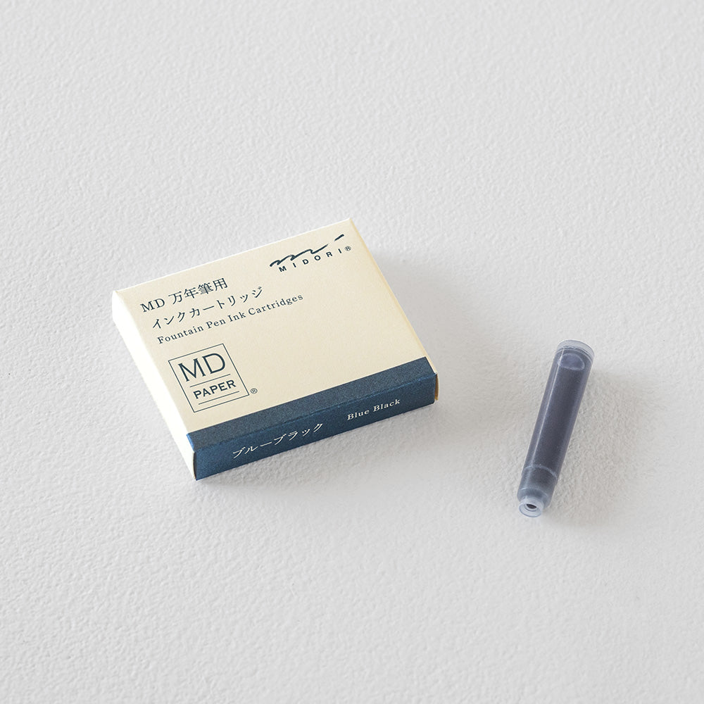 Close-up of an MD Paper Fountain Pen Ink Cartridge next to its packaging, emphasising the quality and design.
