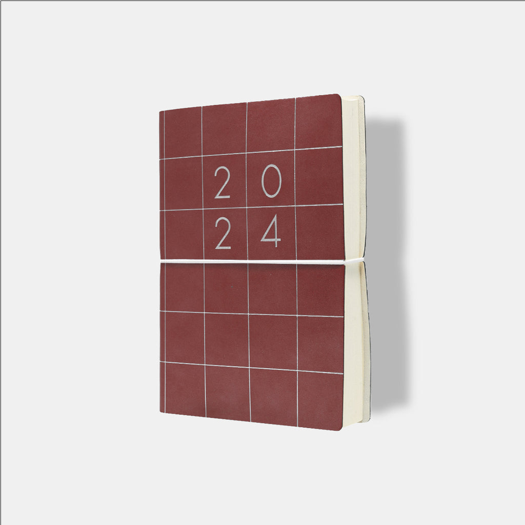 Ciak Squared 2024 Diary with a doré grid design on the cover.