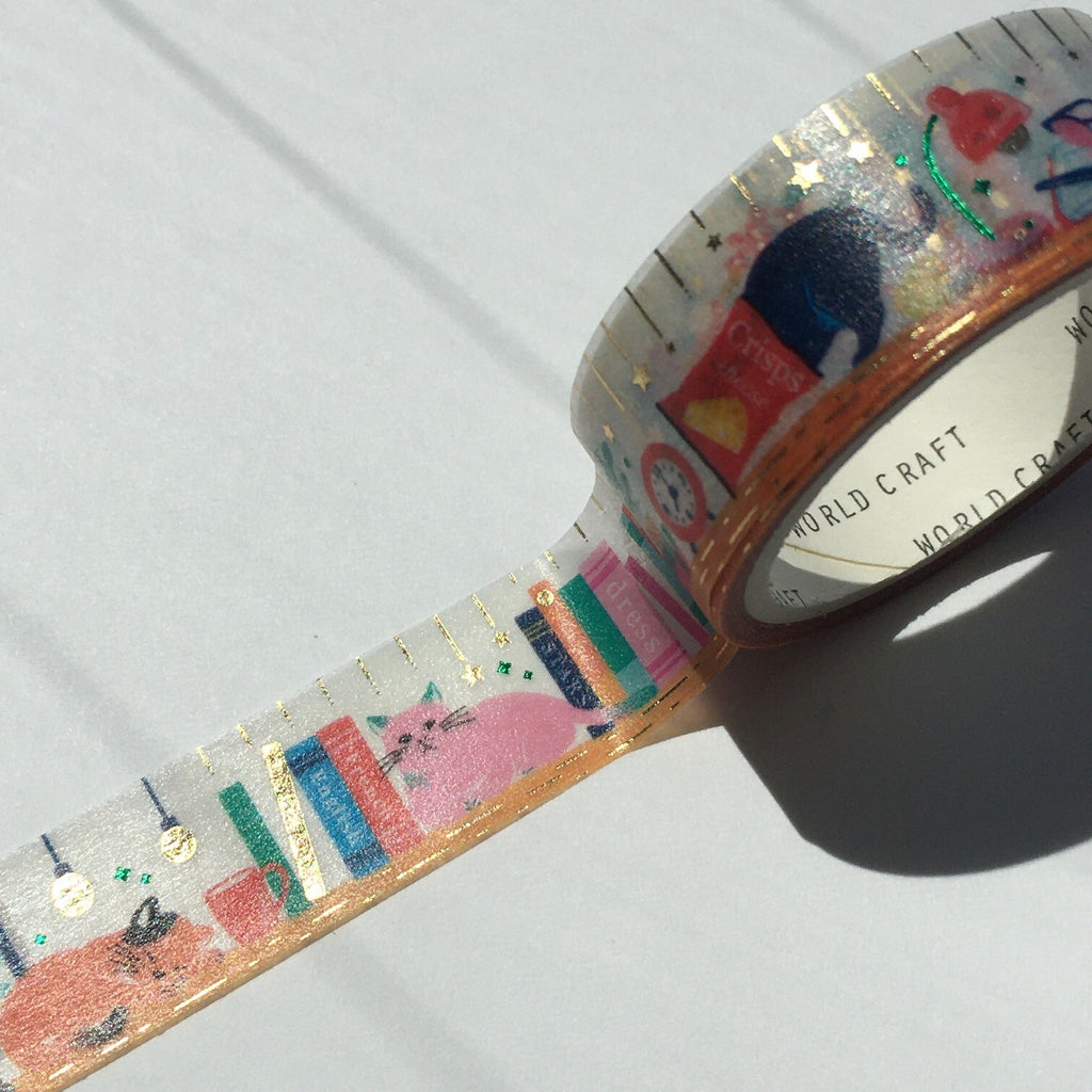 Unrolled World Craft Glitter Masking Tape showing a library scene with cats, books, and desk accessories on a glittery background.
