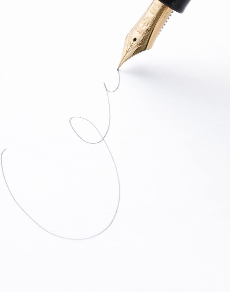 A fountain pen writing on a plain Apica Limited Edition Premium CD Notebook A5