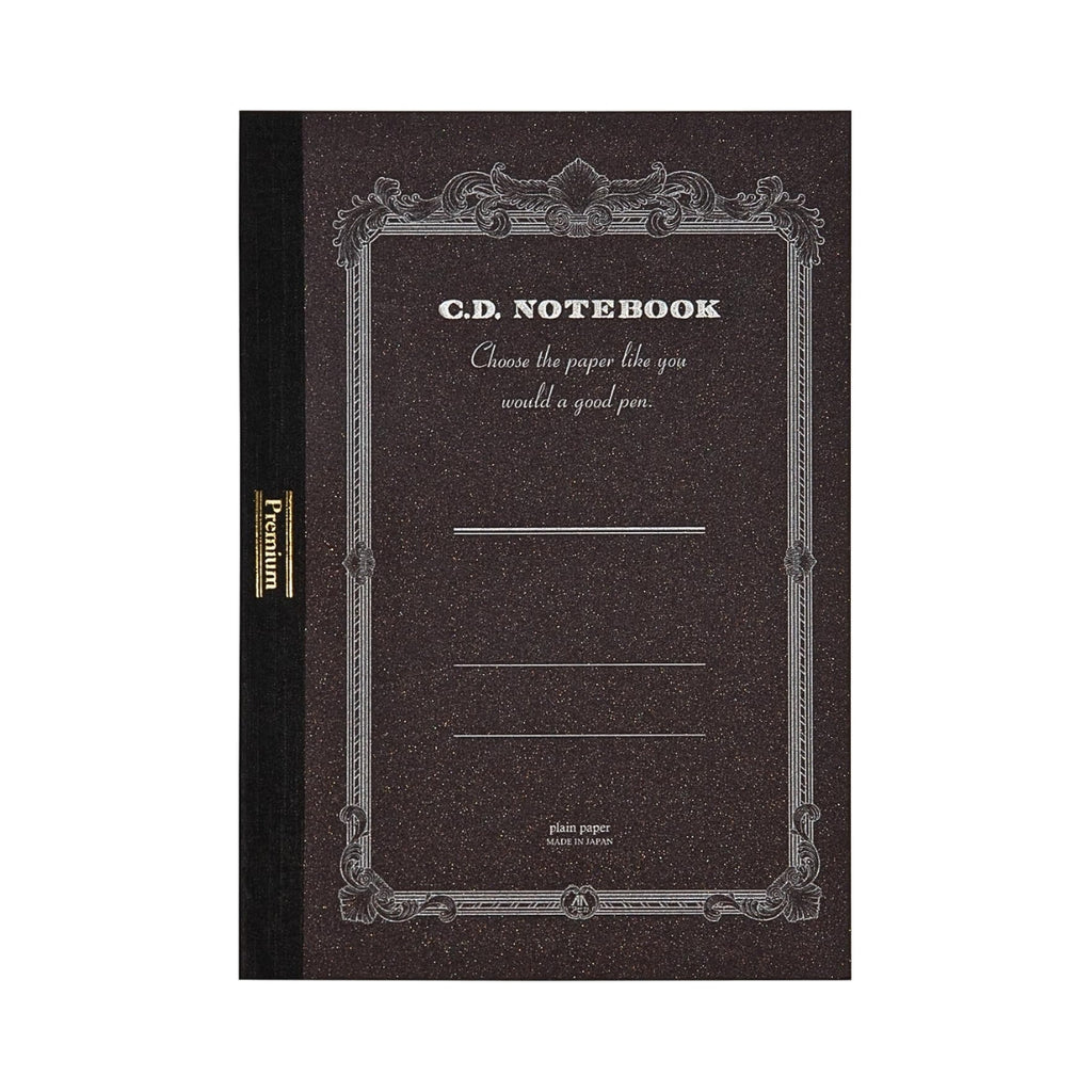 Apica Premium CD Notebook A5 Plain in dark brown displayed upright with ornate silver-printed cover detailing.