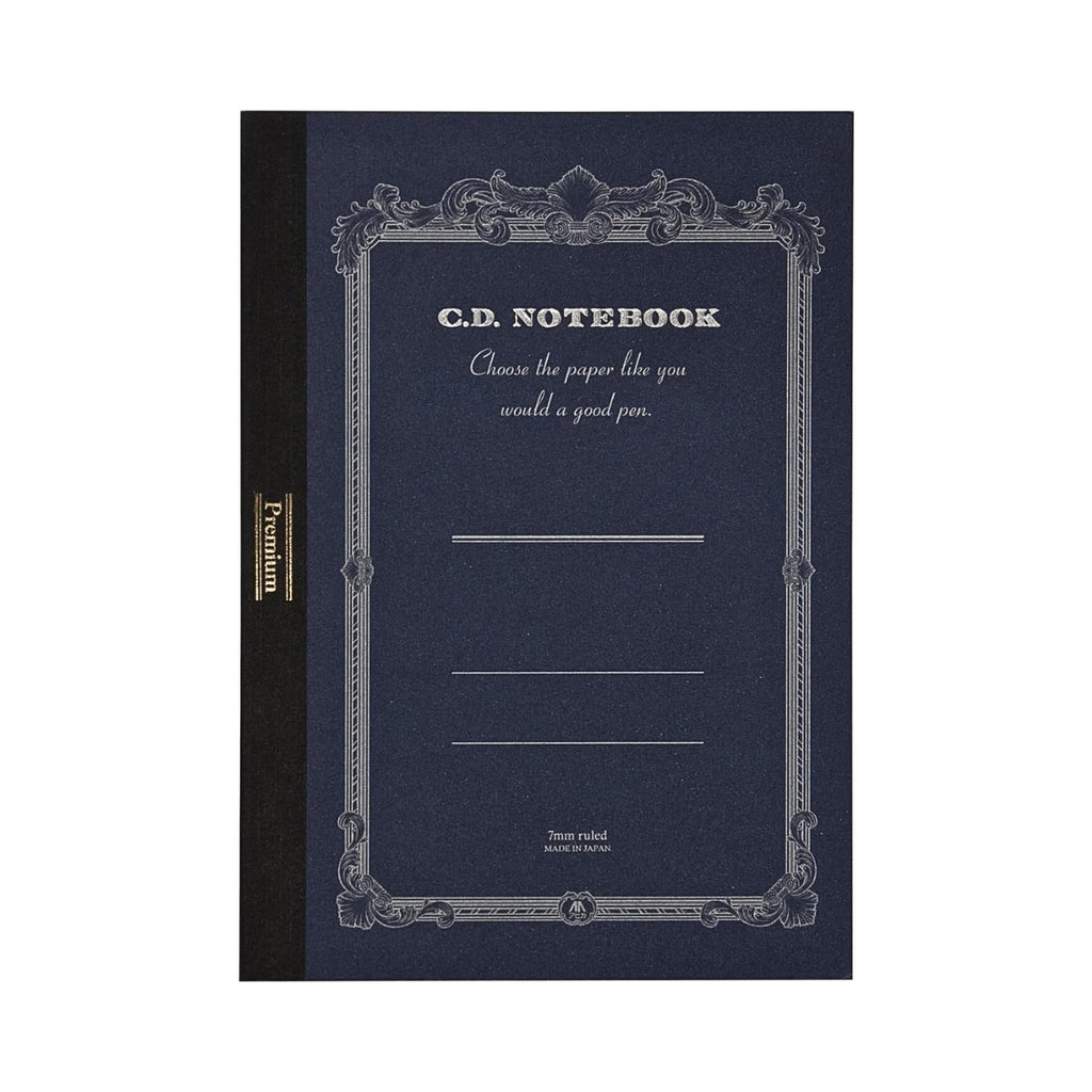 Apica Premium CD Notebook A5 Ruled in navy blue displayed upright with its ornate silver-printed cover design.