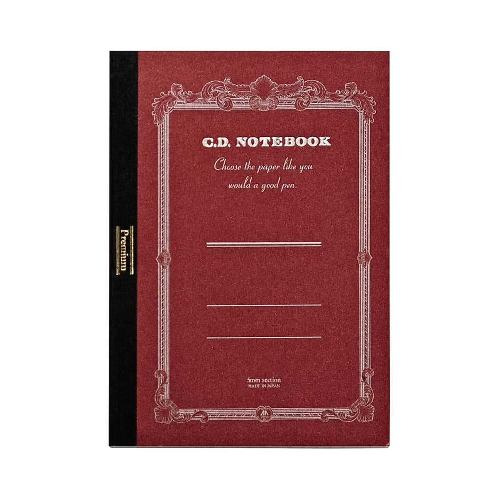 Front cover of the Apica Premium C.D Notebook A6 Grid with ornate border design.