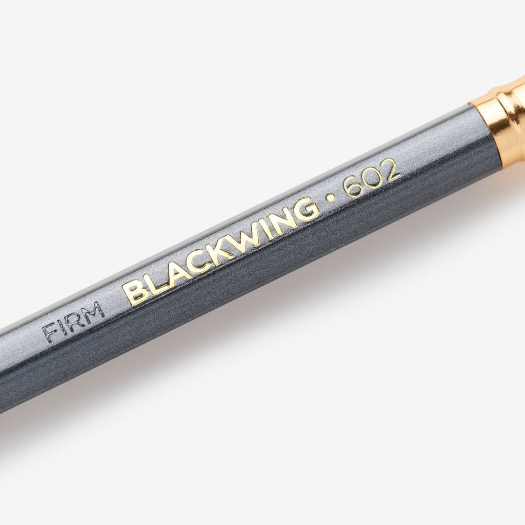 Close-up of the Blackwing 602 pencil barrel showing the slogan “Half the Pressure, Twice the Speed”.