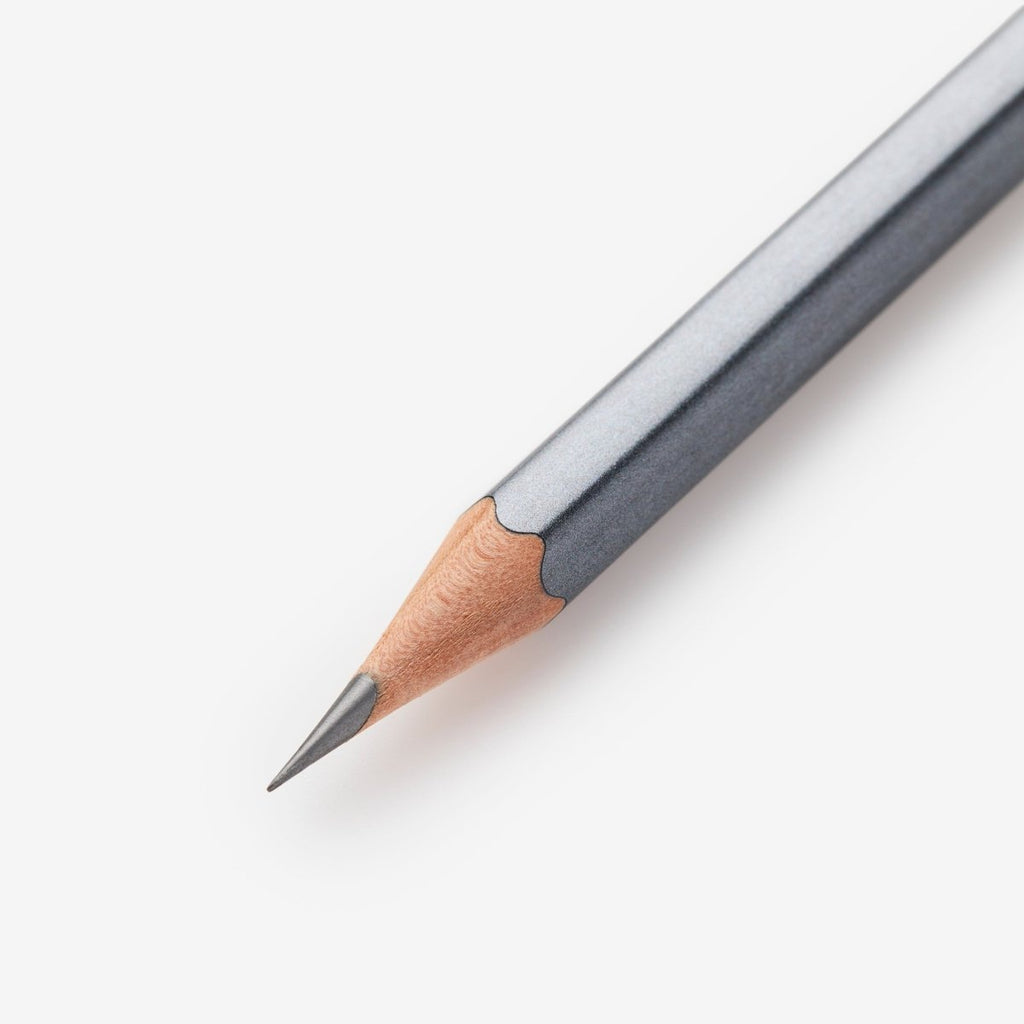 Close-up of the sharpened graphite point of a Blackwing 602 pencil.