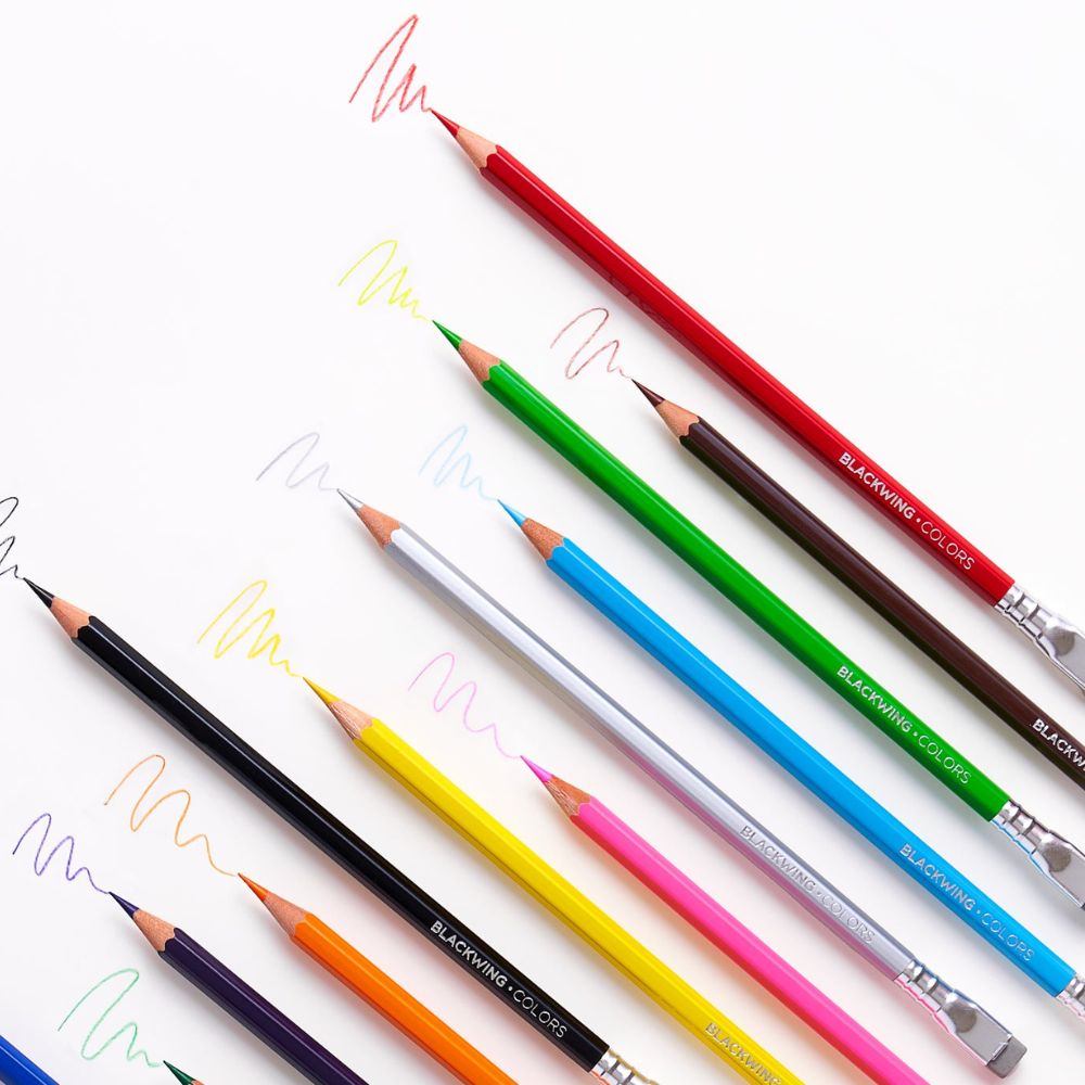 Overhead view of mixed Blackwing Colors pencils fanned out to display vibrant hues.