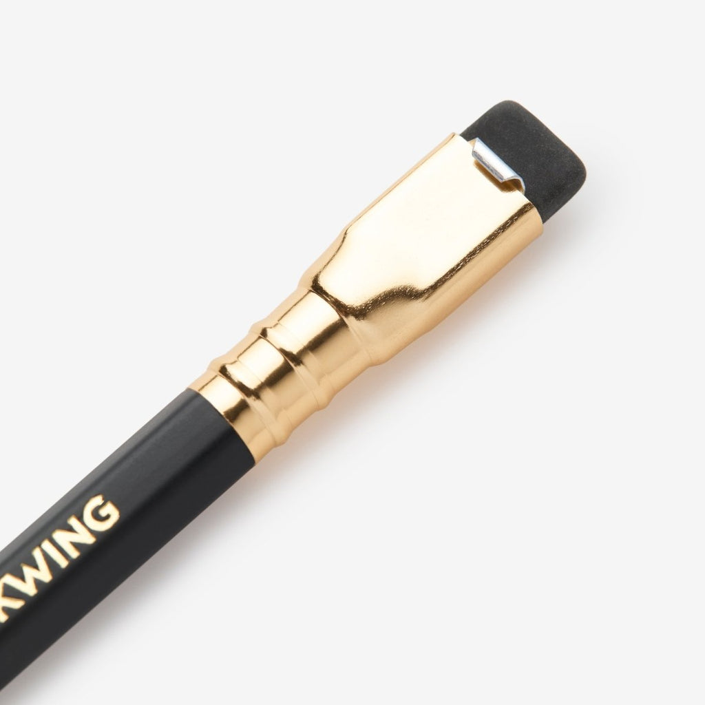 Close-up of the Blackwing Matte’s gold ferrule with replaceable black eraser.