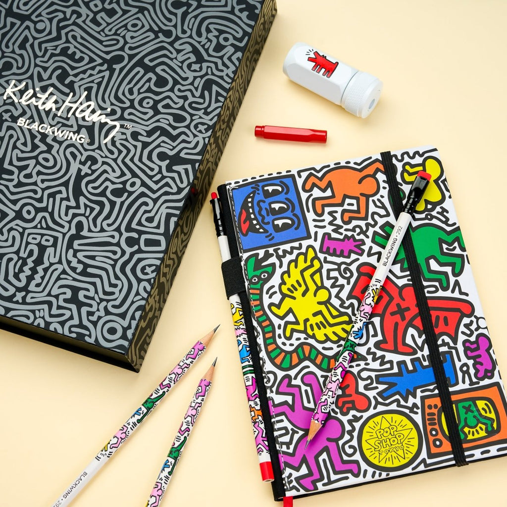 The Journal Shop - Blackwing Volume 292 Gift Set Keith Haring Tokyo Pop-Shop edition notebook and stationery flatlay.
