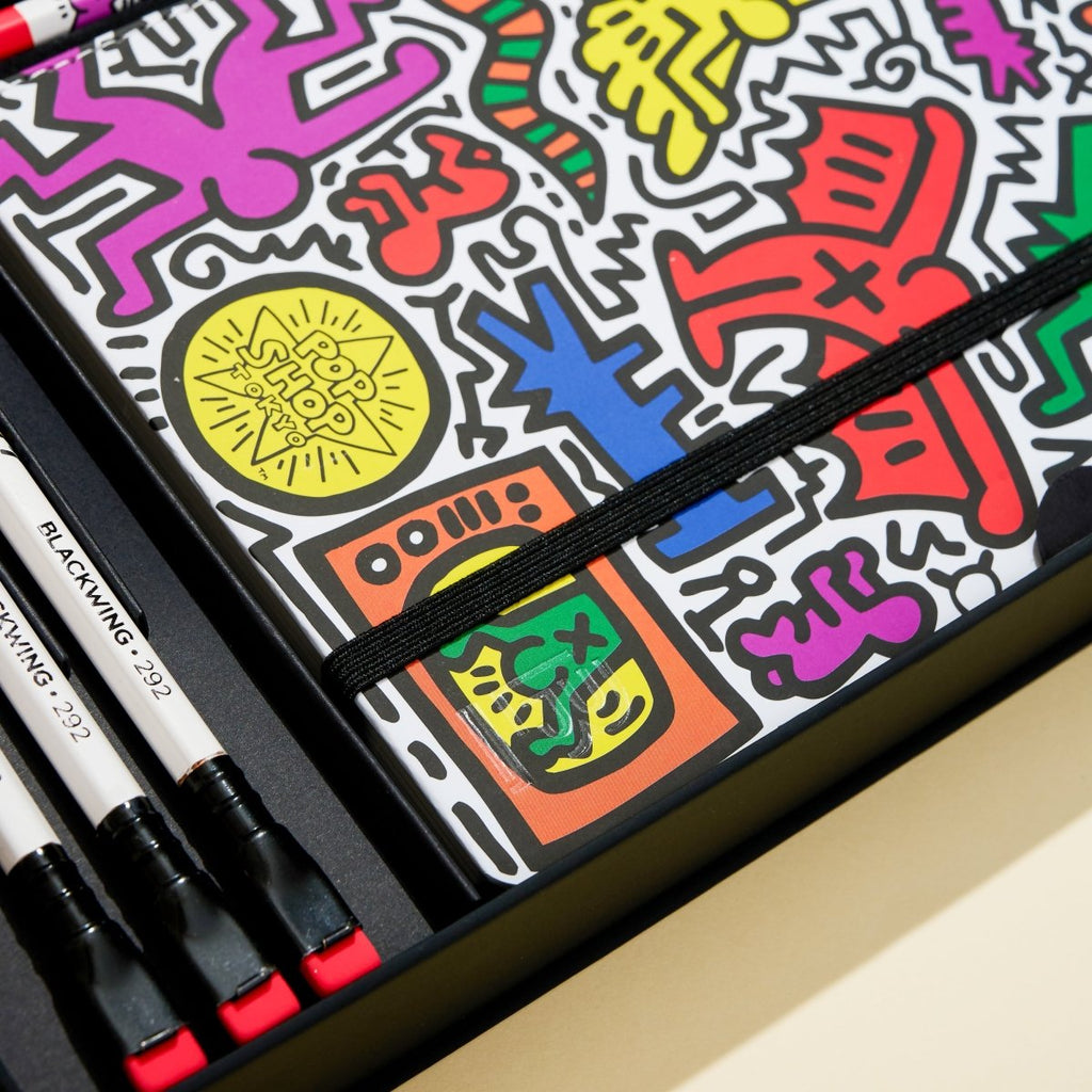 The Journal Shop - Blackwing Volume 292 Gift Set Keith Haring Tokyo Pop-Shop edition notebook and pencils detail with colourful pattern.