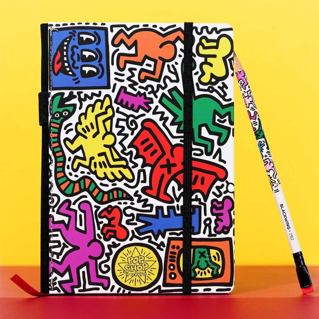 The Journal Shop - Blackwing Volume 292 Notebook Keith Haring Tokyo Pop-Shop edition with pencil on bright yellow background.