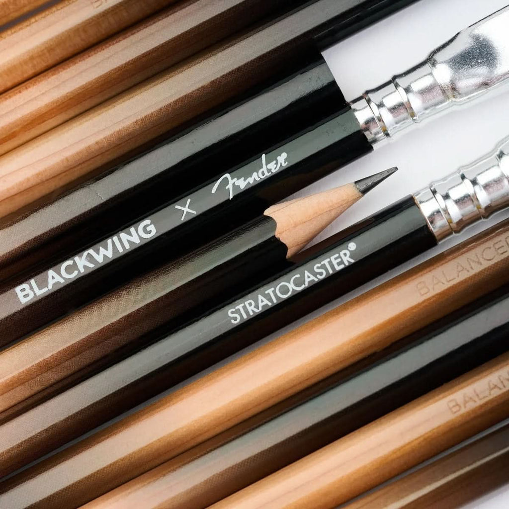 Extreme close-up of sharpened and unsharpened Blackwing x Fender pencils, highlighting logo and details.