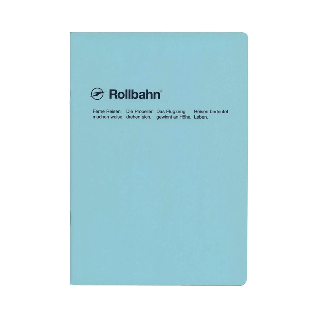 Front cover of a light blue Rollbahn notebook with dark German text and a simple, elegant appearance.