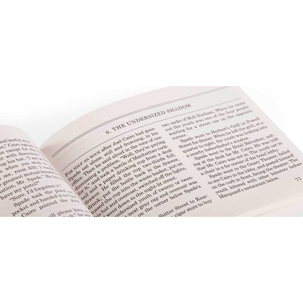 Open Field Notes “The Maltese Falcon” Limited Edition book showing printed text on cream-coloured pages.