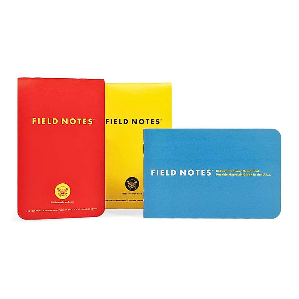 Red, yellow, and blue Field Notes Two-Way Memo Books arranged side by side on a white background.