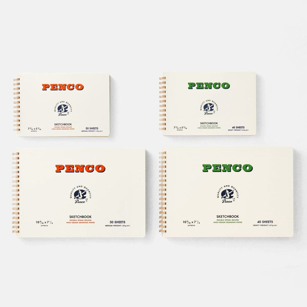 Selection of four Penco sketchbooks in small and large sizes with orange and green logos, arranged on a white background.