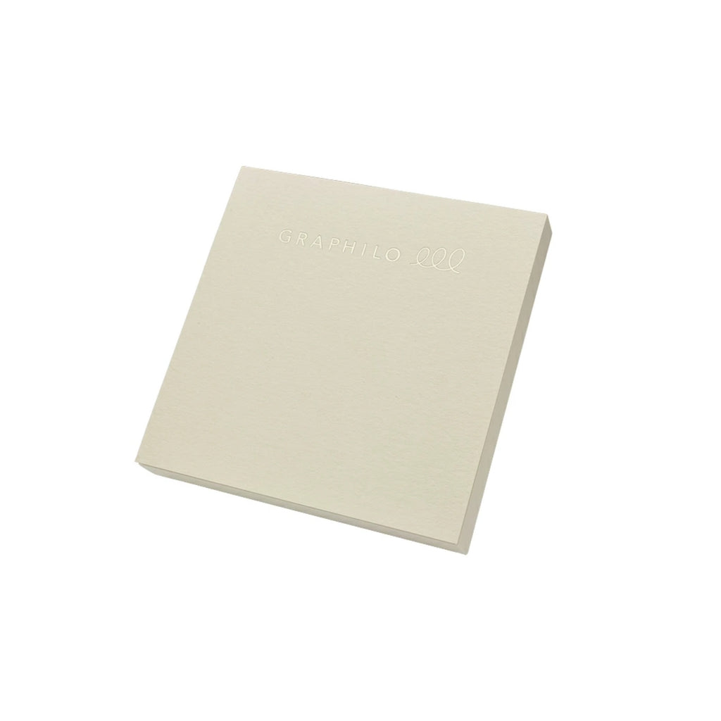 Angled view of GRAPHiLO note pad showing cover with embossed logo.