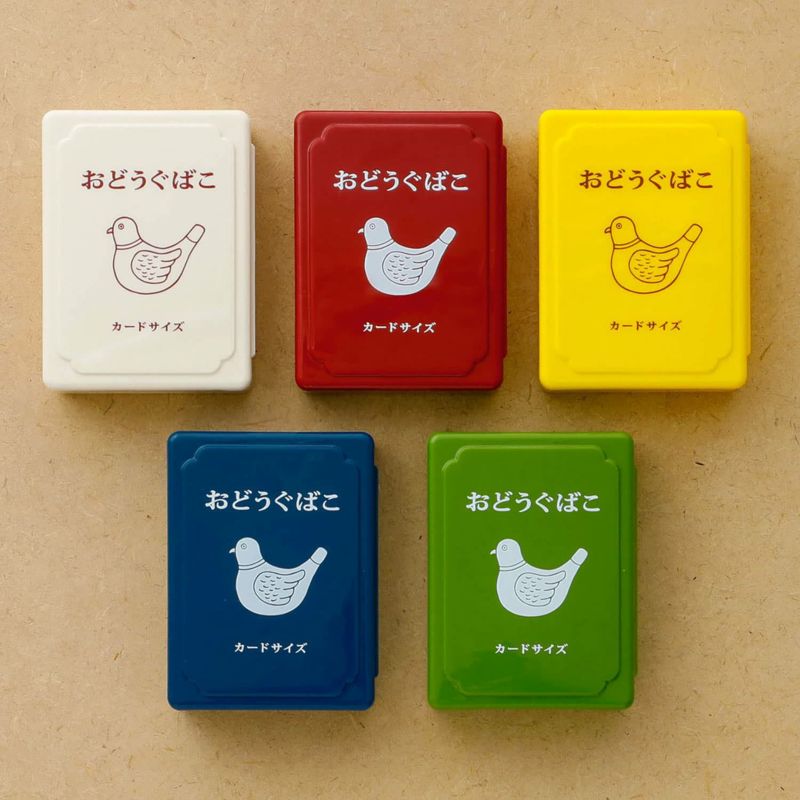 Mini tool boxes in ivory, red, yellow, blue, and green with printed chicken design