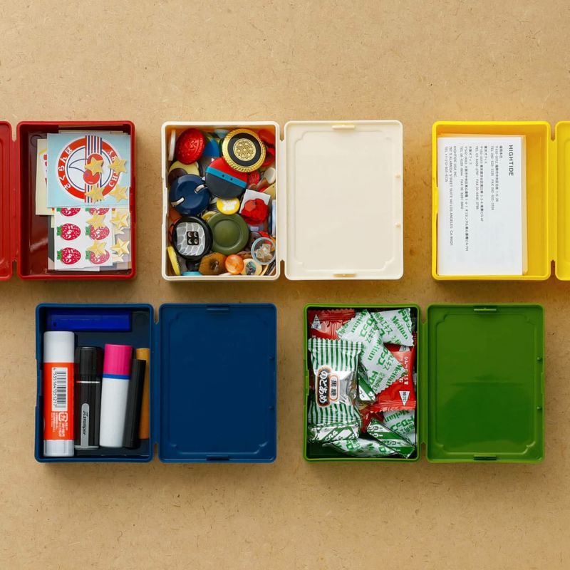Inside view of five colourful plastic mini tool boxes used for storage