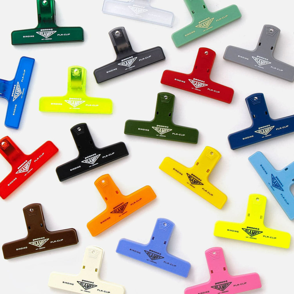 The Journal Shop - Collection of colourful Hightide Penco Clampy Pla-Clips arranged on a white background in assorted bright shades.