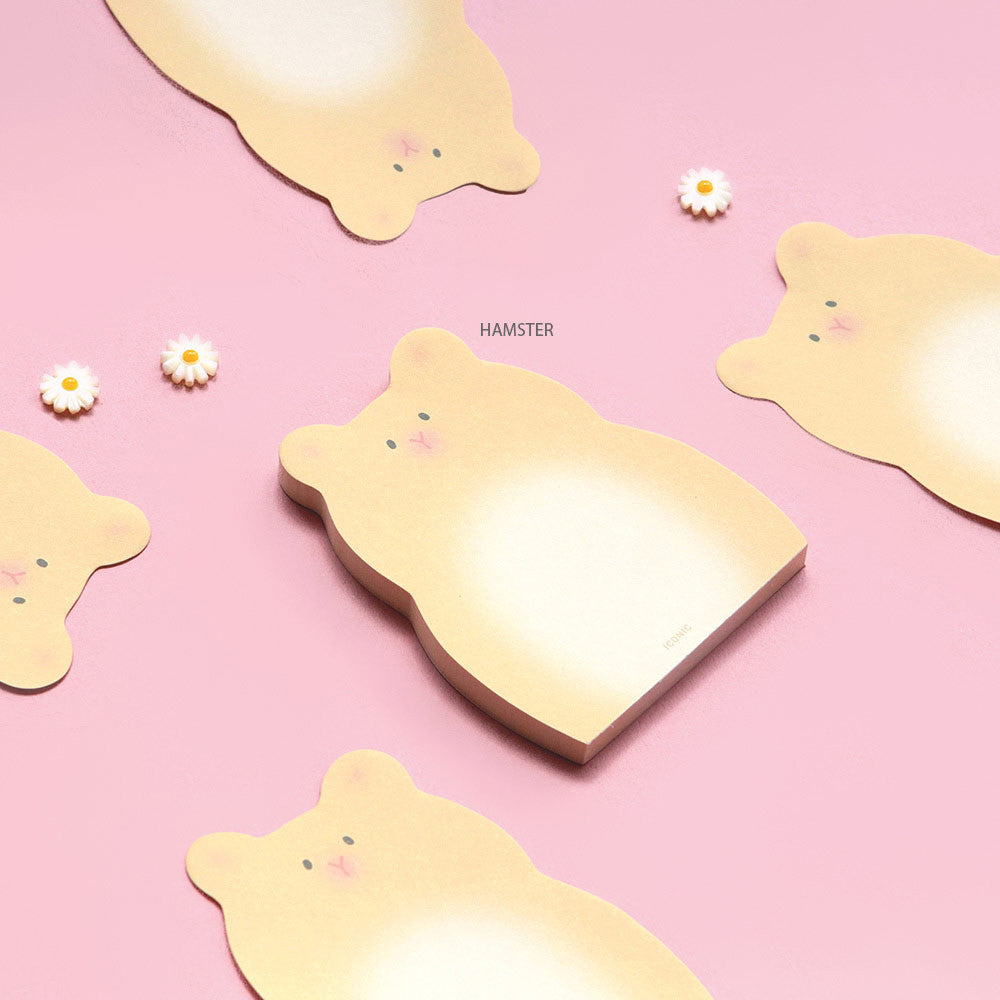 The Journal Shop - Iconic Animal Memo Pads in animal shapes laid on a pastel pink background beside small decorative items.