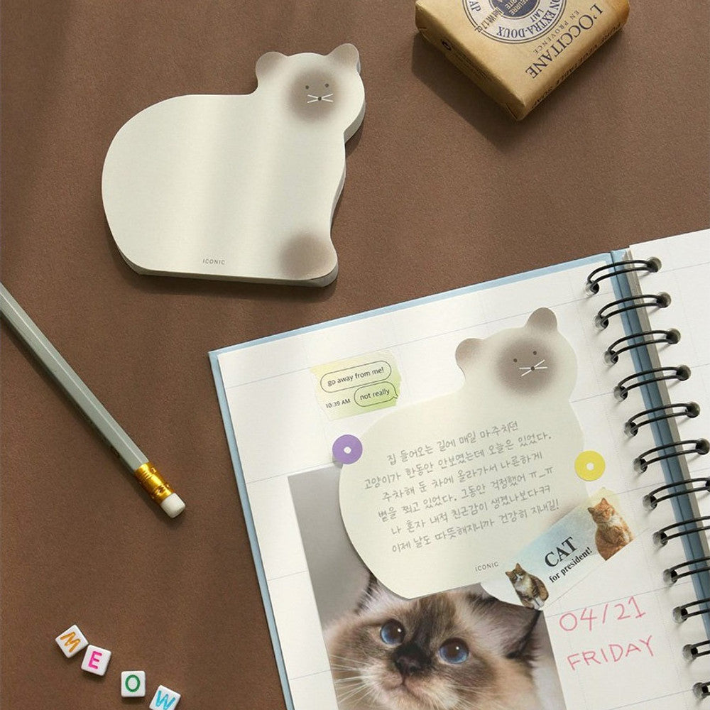 The Journal Shop - A brown cat-shaped memo pad placed beside a pencil and open planner on a tidy wooden desk.