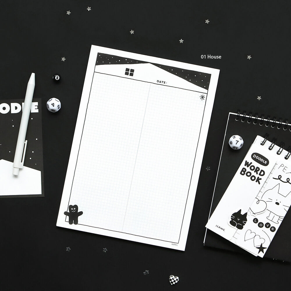 Iconic Doodle B5 Grid Notepad black cover version displayed on desk with stationery.