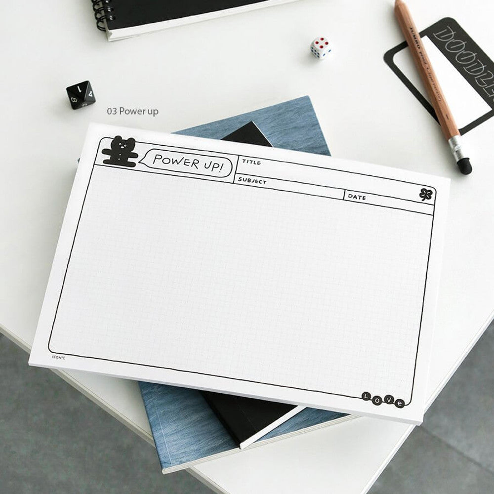 The Journal Shop - iconic doodle B5 grid notepad power up in white color.