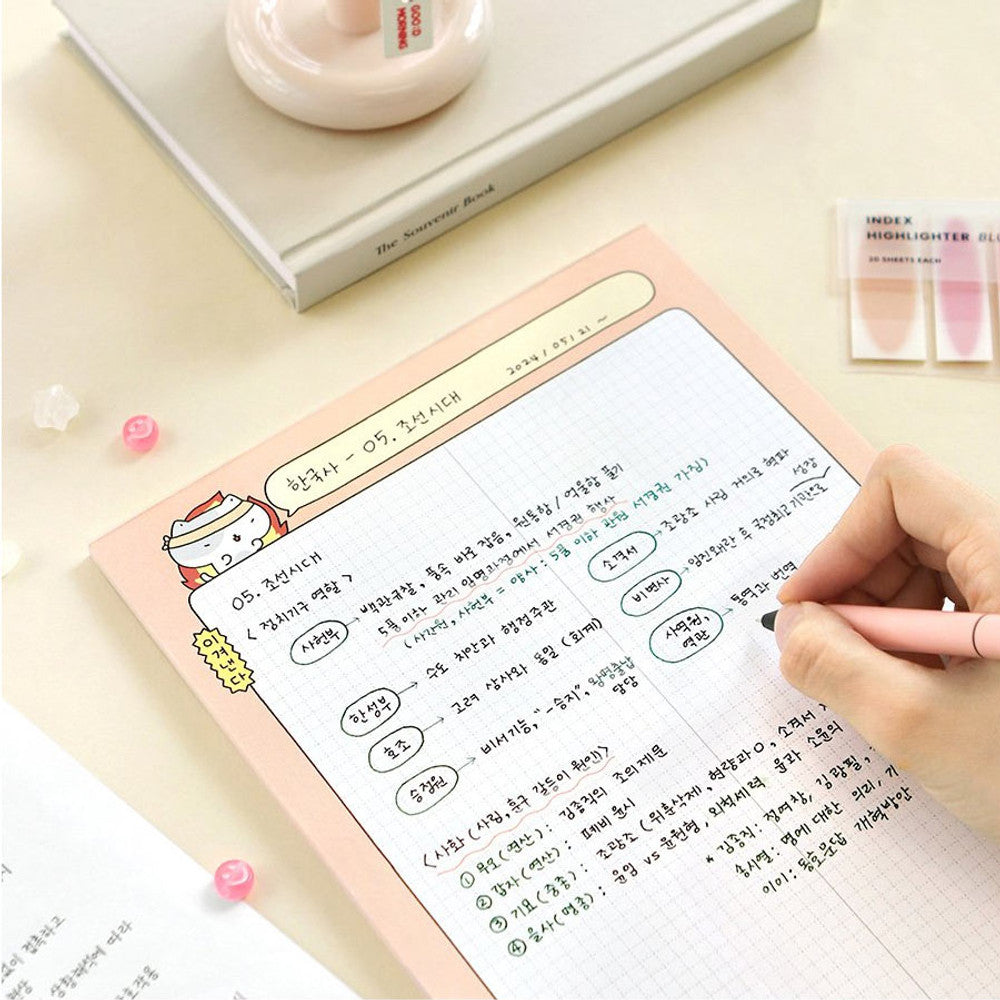 The Journal Shop - Iconic Blah Blah B5 Memo Notepad open on pink background with handwriting in progress.