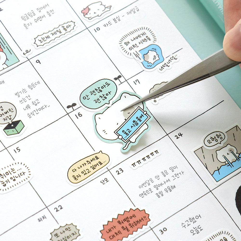 The Journal Shop - Close-up of a planner decorated with small Iconic Blah Blah stickers marking daily activities and reminders.