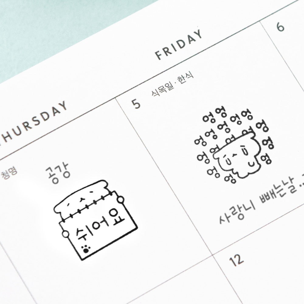 The Journal Shop - Close-up of black-and-white stamped designs from the Iconic Blah Blah Diary Stamp collection on a calendar page.