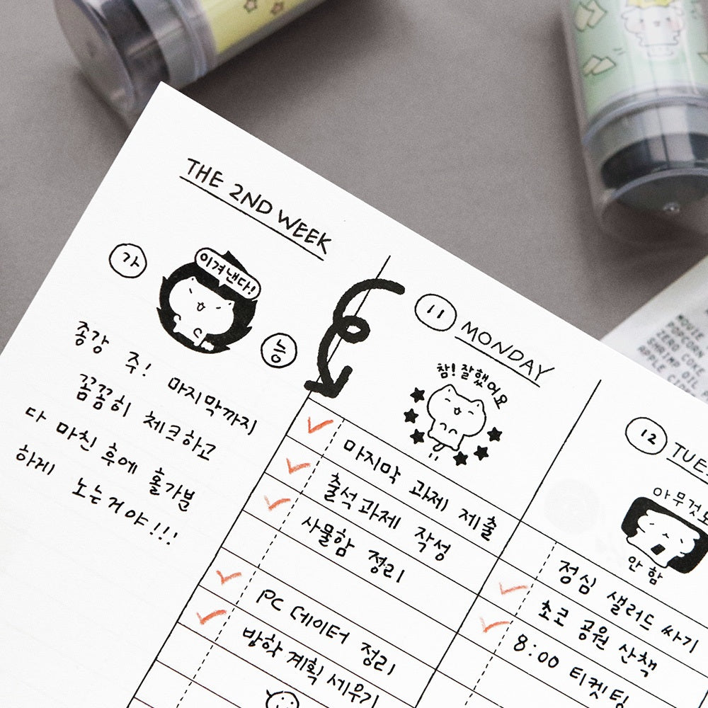 The Journal Shop - Close-up of a diary page decorated with Iconic Blah Blah Diary Stamp impressions showing cute illustrated expressions.