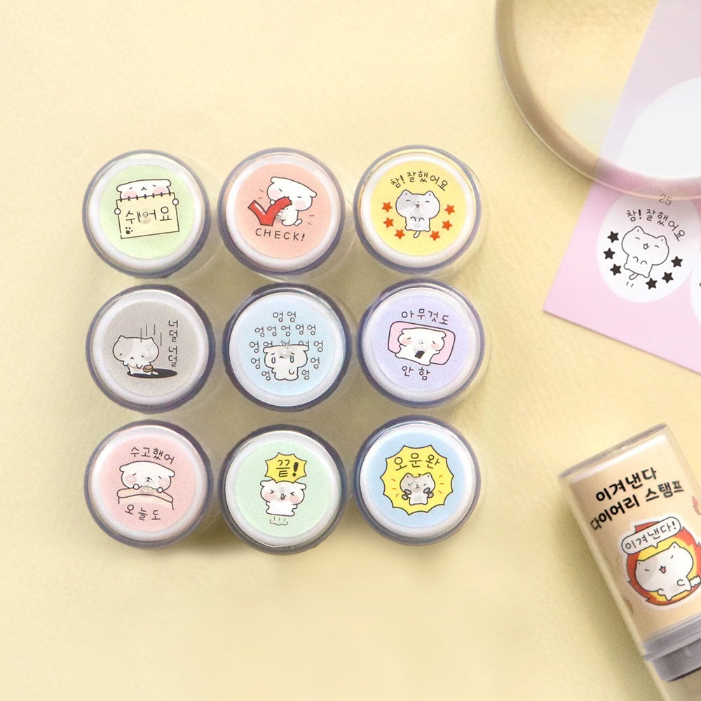 The Journal Shop - Top view of multiple Iconic Blah Blah Diary Stamps in assorted pastel colours arranged in a neat circle on a yellow background.