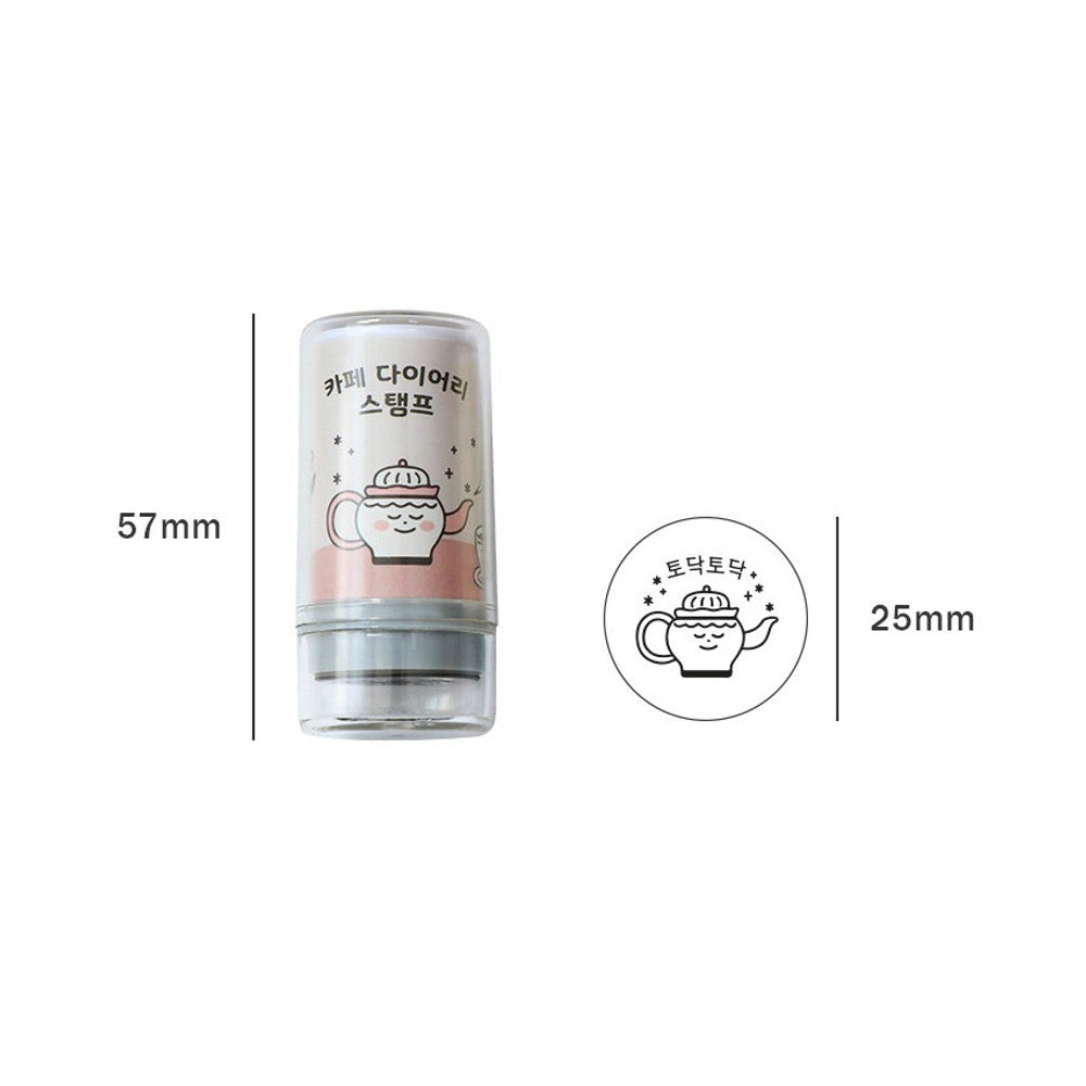 The Journal Shop - Single pastel-coloured café stamp with transparent casing displayed upright on a light background.