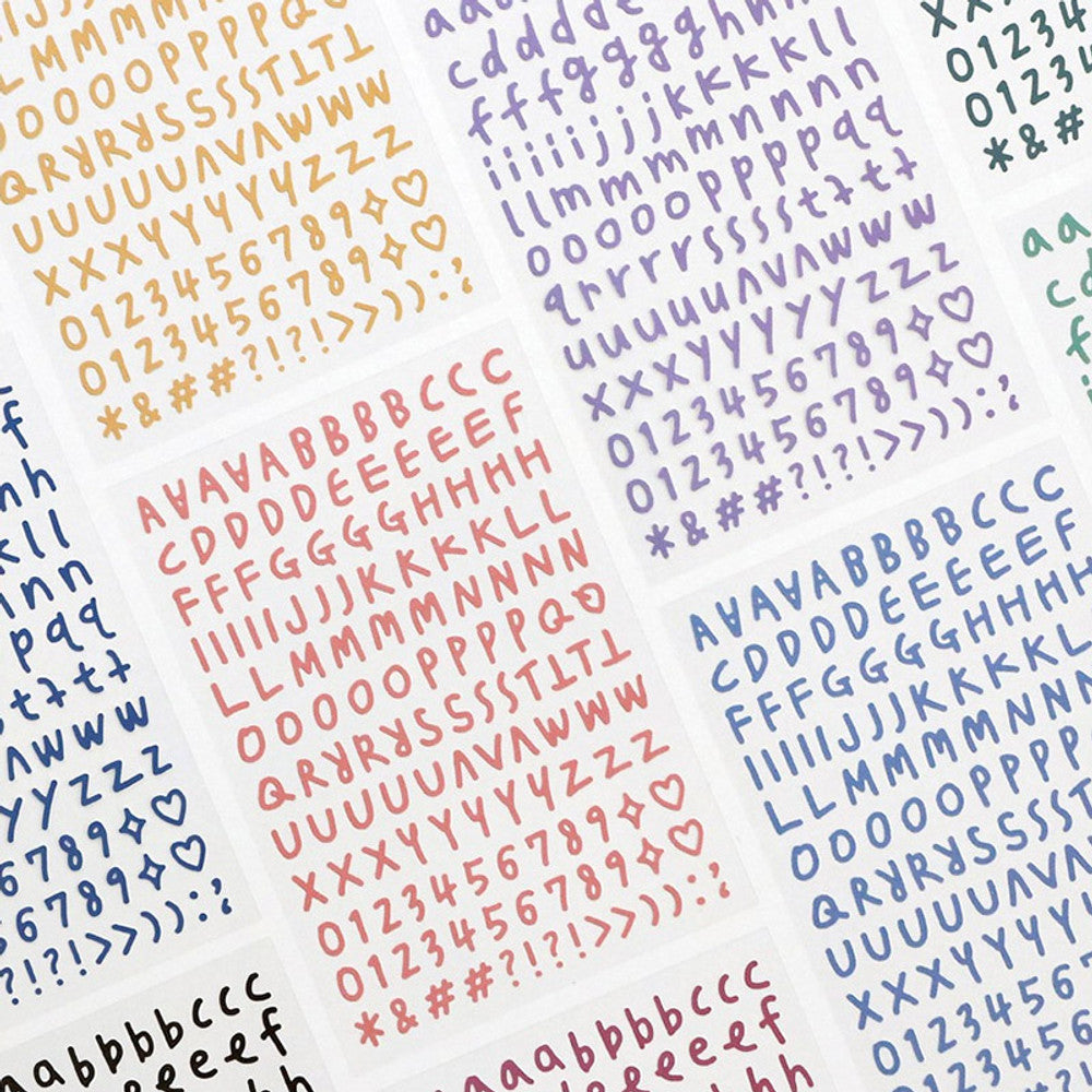 The Journal Shop - Sheets of Calli Alphabet Stickers in soft pastel colours placed neatly on a white background.