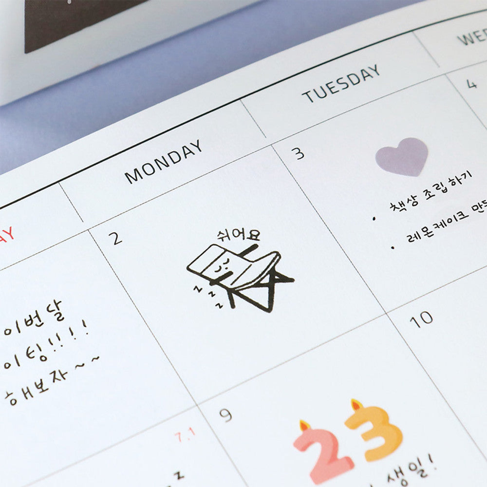 The Journal Shop - Planner page decorated with small camping-themed stamps including tents, heart, and number icons.