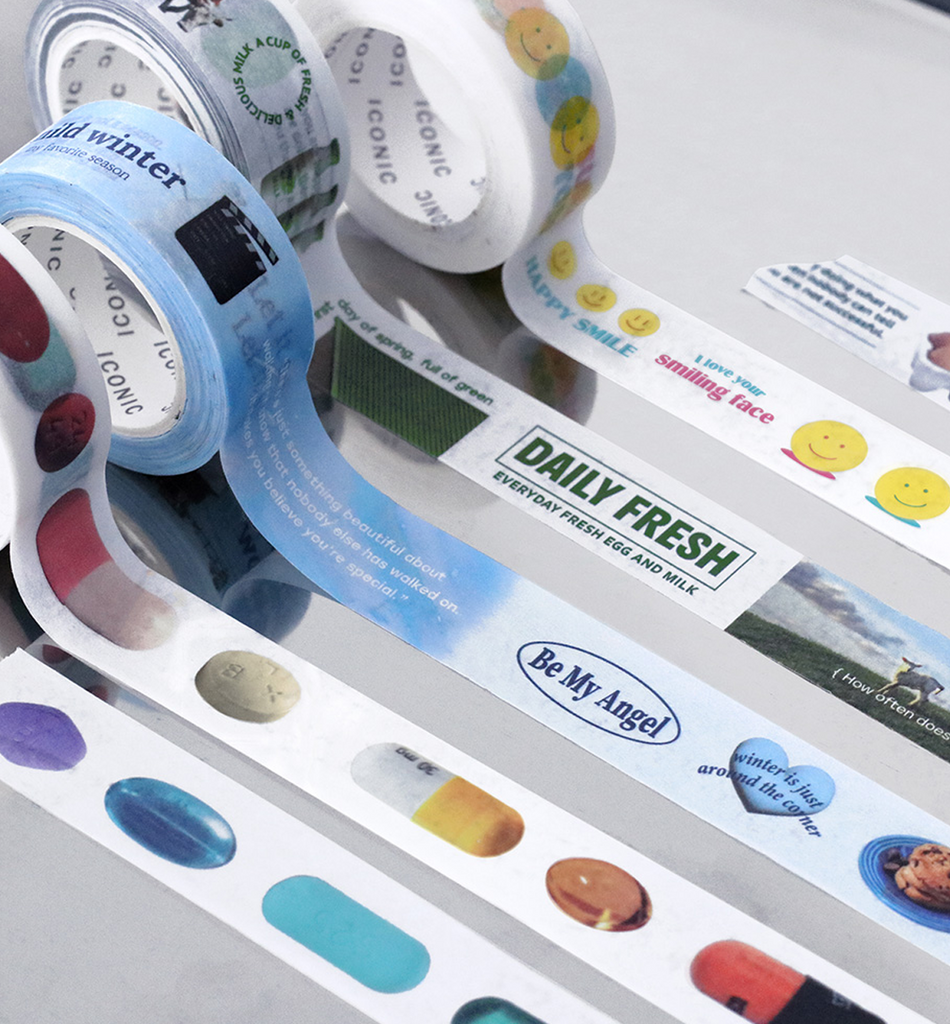 The Journal Shop - Close-up of Iconic Collect Masking Tape rolls unrolled to reveal colourful label-style designs with text and patterns.