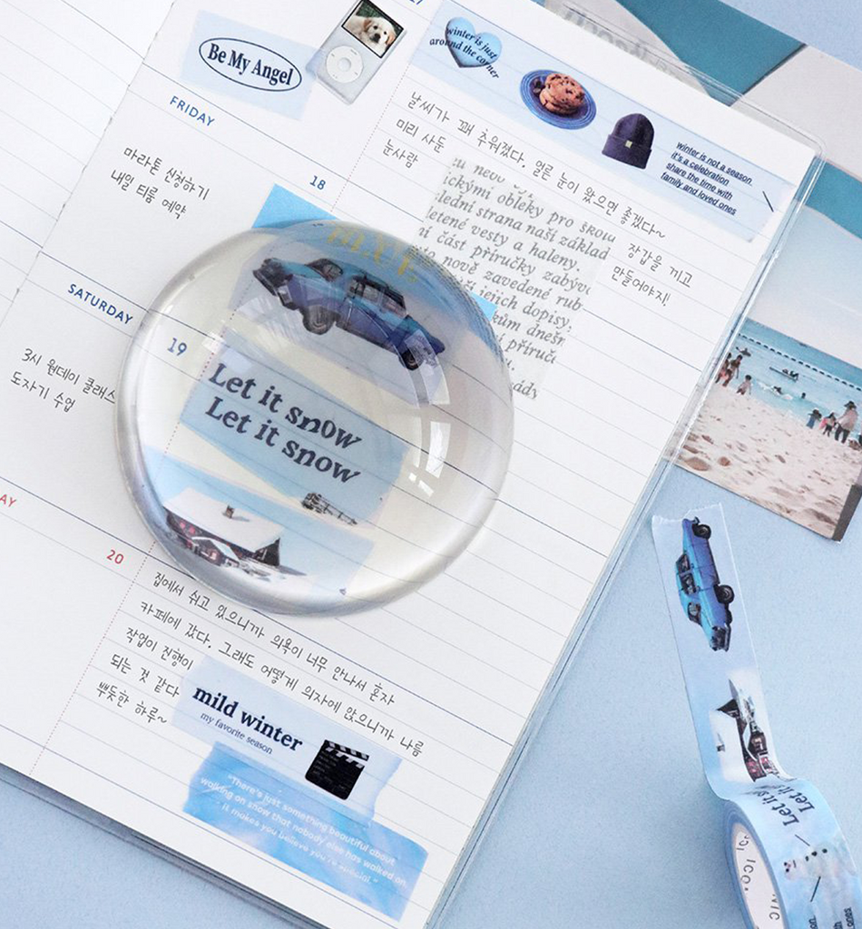 The Journal Shop - Roll of blue-themed Iconic Collect Masking Tape paired with a decorated notebook on a pastel background.
