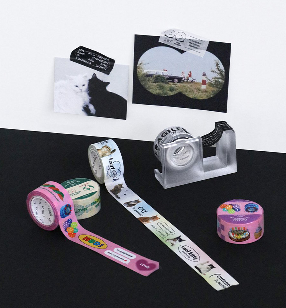 The Journal Shop - Three rolls of Iconic Collect Masking Tape displayed on a desk with printed label-style and collage designs.