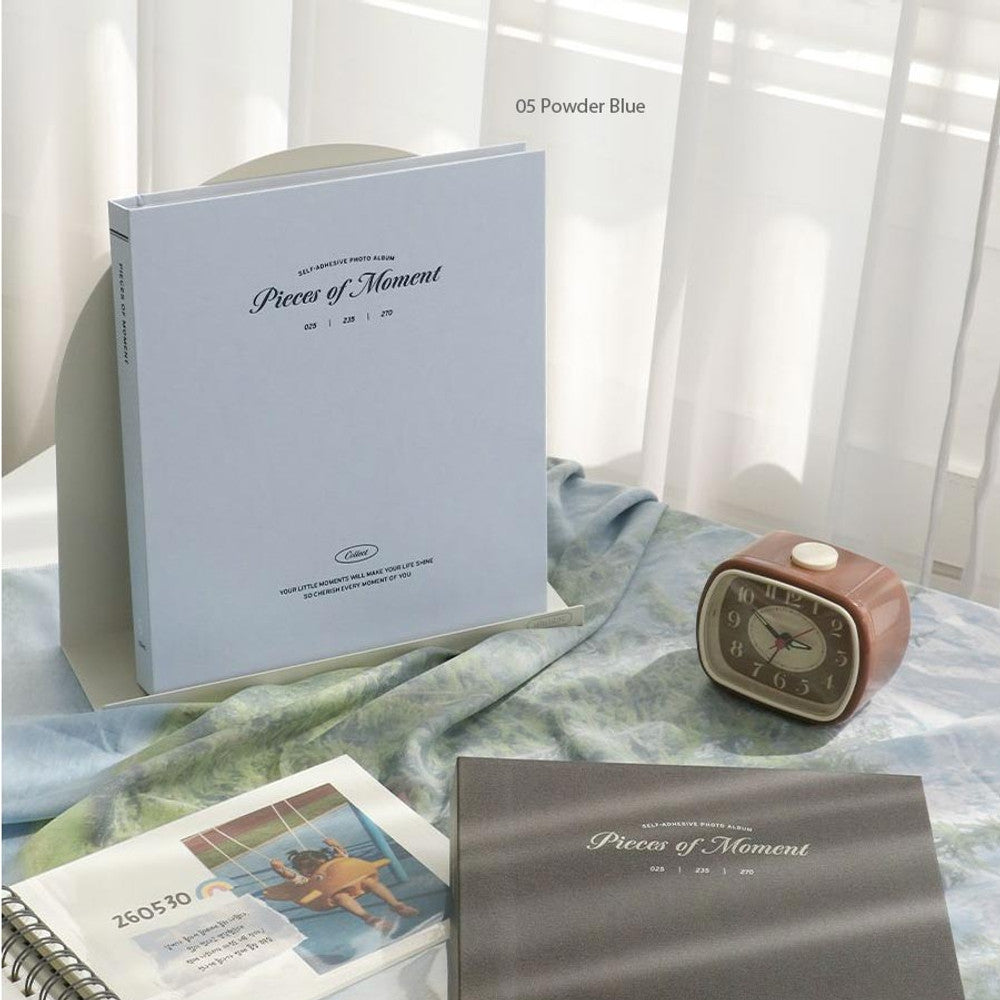 The Journal Shop - Iconic Collect Self-Adhesive Photo Album 25 sheets in powder blue shown with open pages and photo prints.