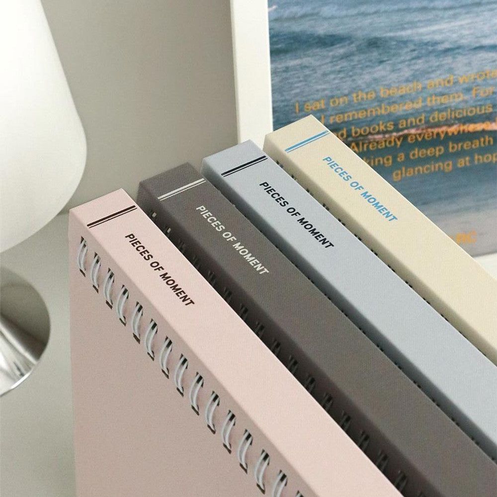 The Journal Shop - Iconic Collect Self-Adhesive Photo Album in beige and pastel covers stacked neatly on desk.
