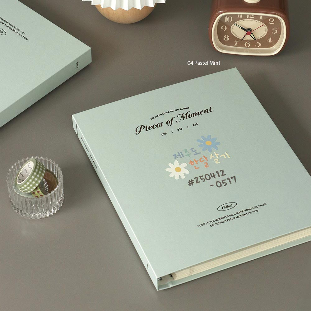 The Journal Shop - Iconic Collect Self-Adhesive Photo Album 25 sheets in mint green cover displayed on desk with decorative items.
