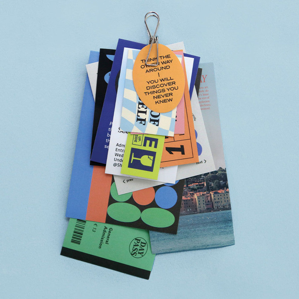 The Journal Shop - Set of Iconic Collect Sticker sheets displayed on a clipboard with colourful stationery.