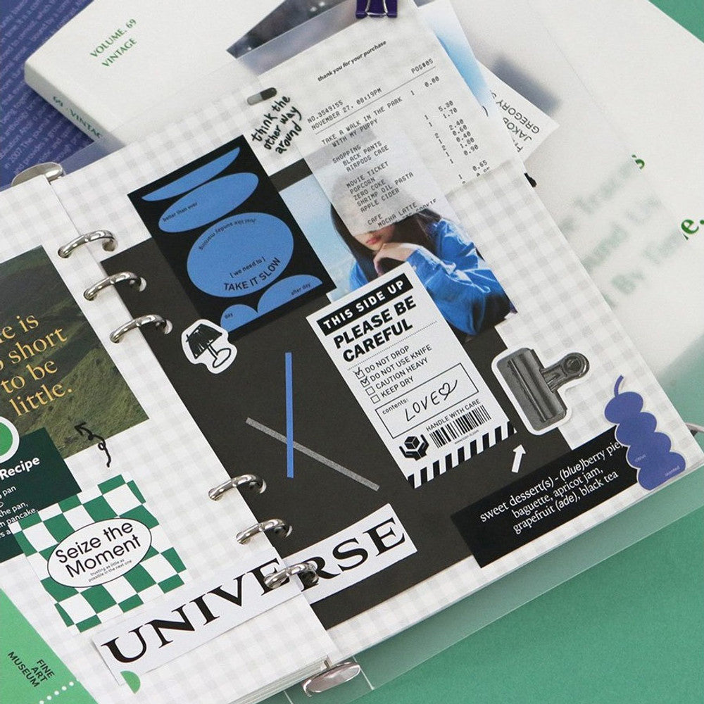 The Journal Shop - Assorted Iconic Collect Sticker sheets and packaging arranged neatly on a green workspace.