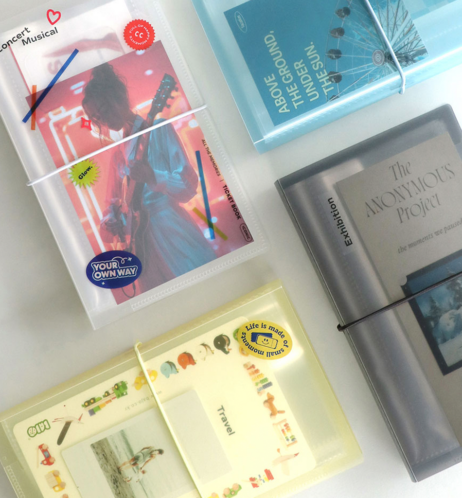 The Journal shop - Iconic Collect Ticket Book 64 pockets being filled with tickets and keepsakes.